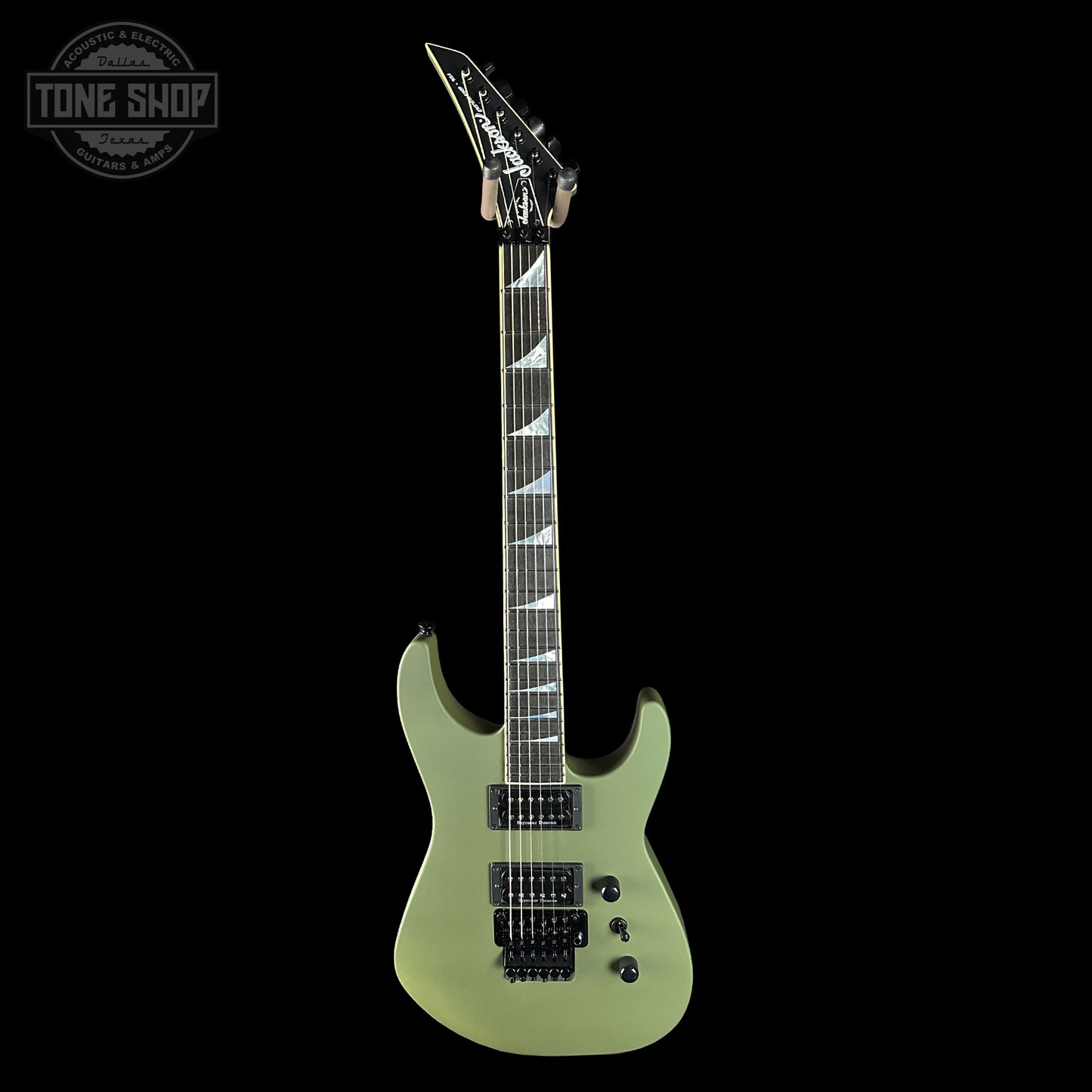 Electric guitar with a black pickguard on a white background