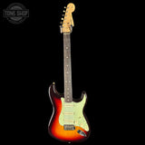 Electric guitar with a sunburst finish on a black background, featuring the Tone Shop logo.