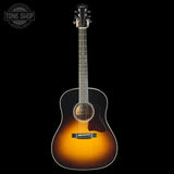 Acoustic guitar with a sunburst finish on a black background, featuring the Tone Shop logo.