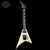 White electric guitar with a black and white pattern on the body against a black background, featuring 'Tone Shop' logo.