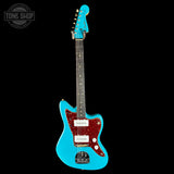 Blue electric guitar with a red pickguard on a black background, featuring 'Tone Shop' branding.