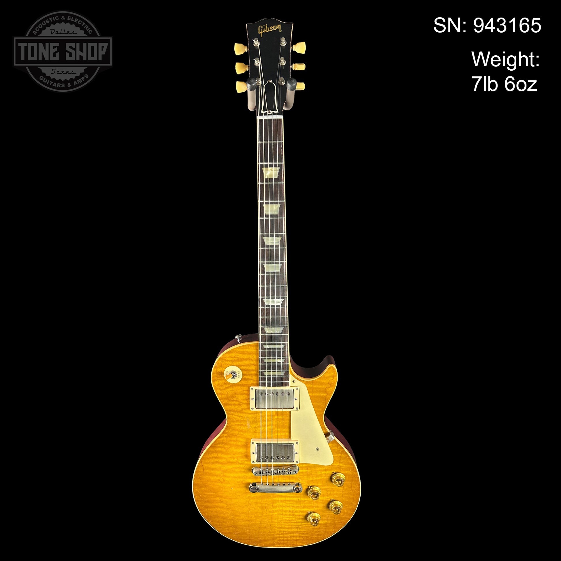 Gibson electric guitar with serial number and weight information on a black background