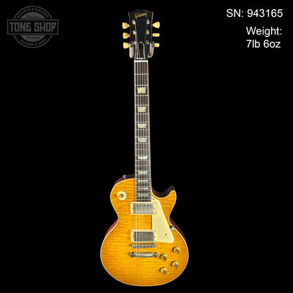 Gibson electric guitar with serial number and weight information on a black background