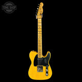 Yellow electric guitar on a black background with 'Tone Shop' logo.