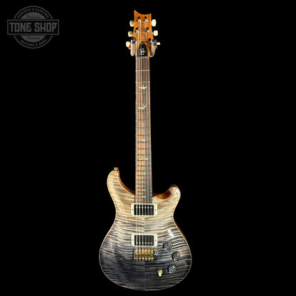 Electric guitar with a wavy wood finish on a black background, featuring the Tone Shop logo.