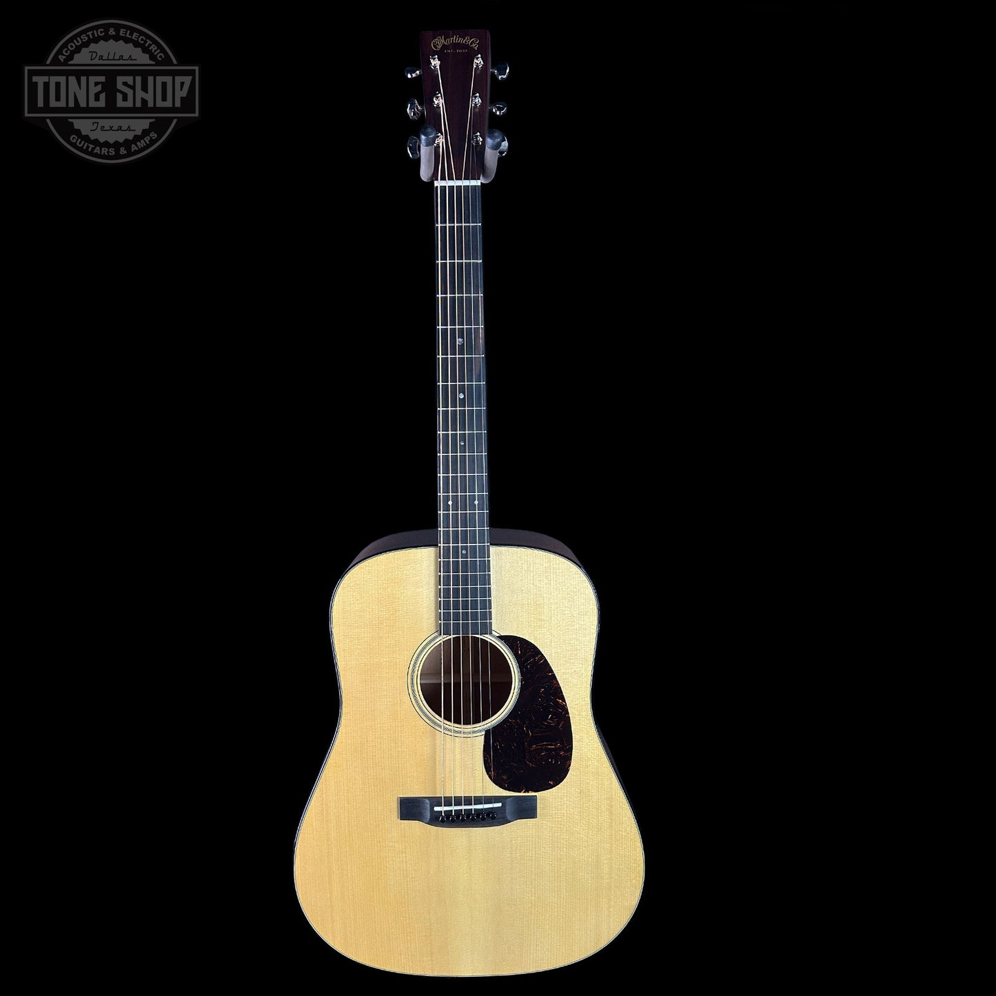 Acoustic guitar with a black background and 'Tone Shop' logo.