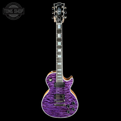 Purple electric guitar with a black background