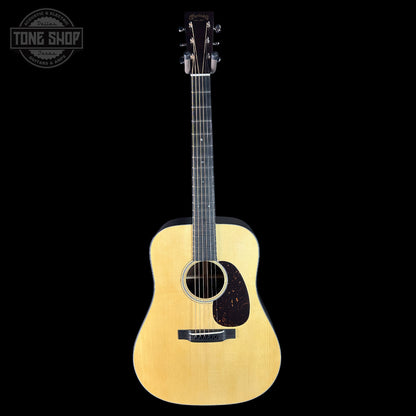 Acoustic guitar on a black background with 'Tone Shop' logo.