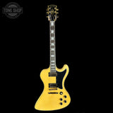Yellow electric guitar on a black background with 'Tone Shop' logo.