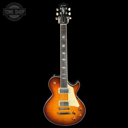 Electric guitar with a sunburst finish on a black background, featuring the Tone Shop logo.
