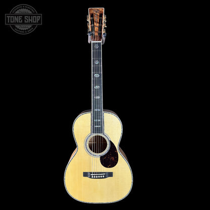 Acoustic guitar with a 'Tone Shop' logo in the corner