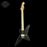 Black electric guitar with a star-shaped body on a black background, featuring 'Tone Shop' branding.