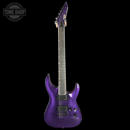 Purple electric guitar on a black background with 'Tone Shop' logo.