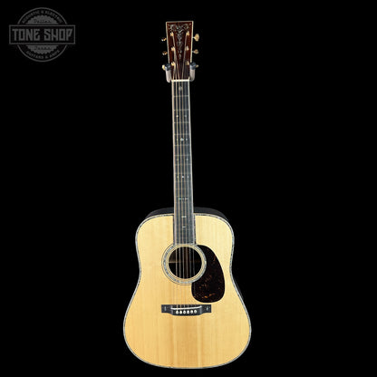 Acoustic guitar on a black background with 'Tone Shop' logo.