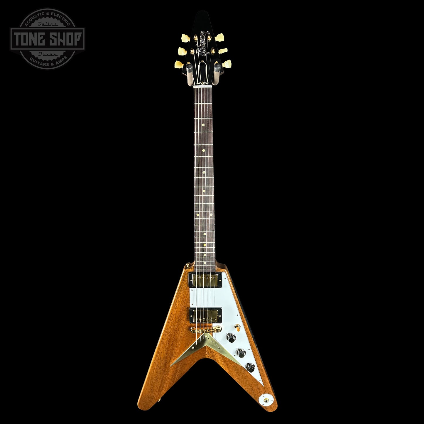 Gibson Flying V electric guitar on a black background with 'Tone Shop' logo.