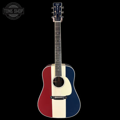 Acoustic guitar with a red, white, and blue design on a black background