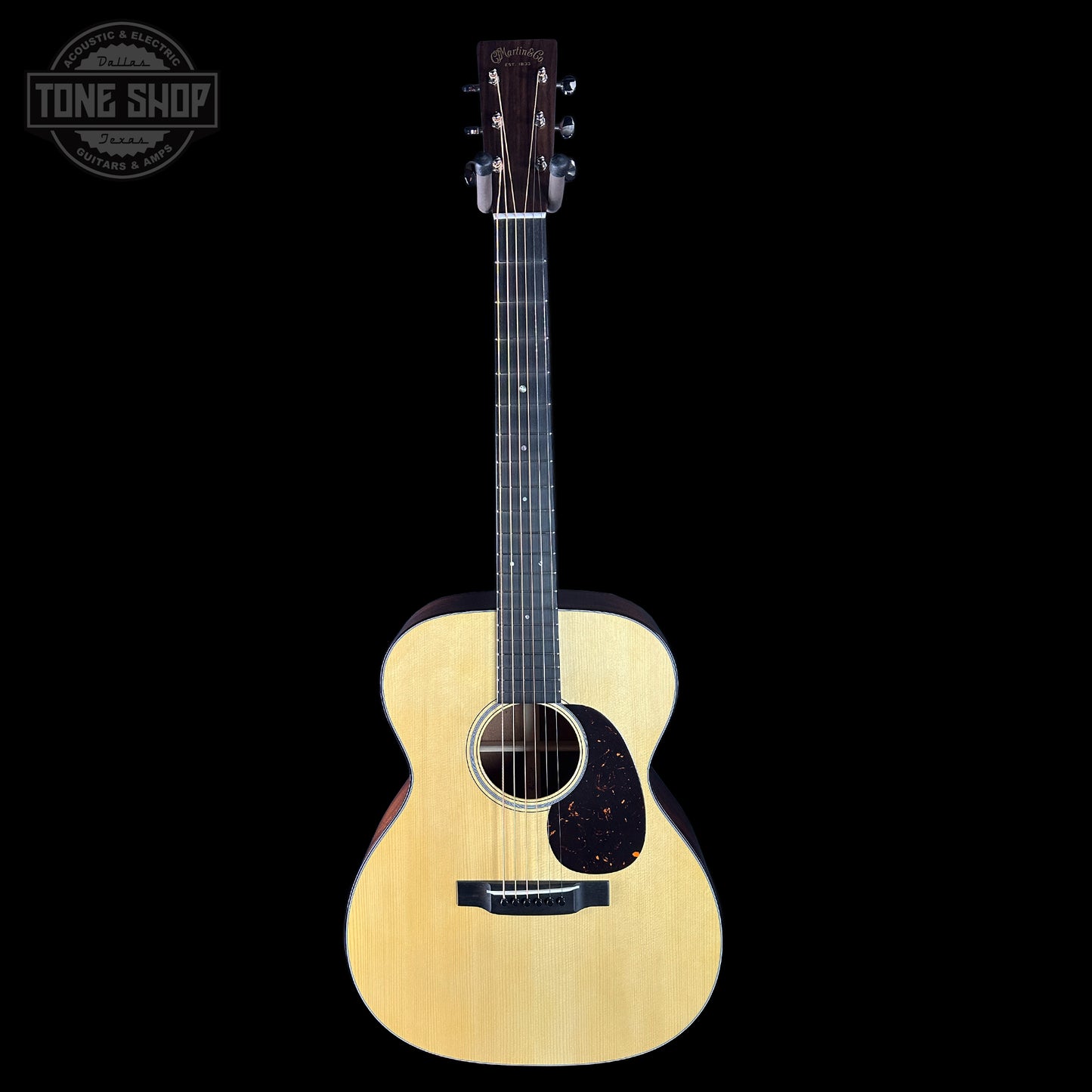 Acoustic guitar on a black background with 'Tone Shop' logo.