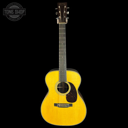 Yellow acoustic guitar on a black background with 'Tone Shop' logo.