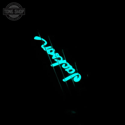 Glowing inlay on headstock of Jackson Custom Shop TSG Illuminati SL2H FR Vanilla Shake.