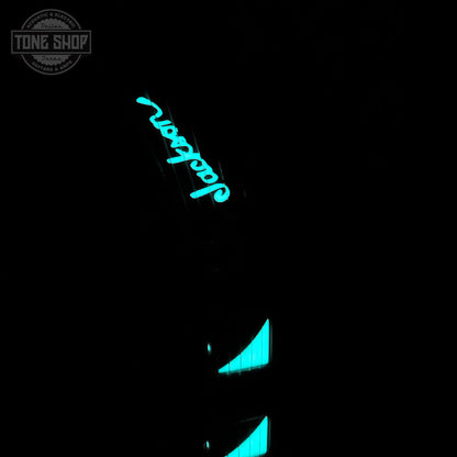 Glowing blue logo on a black background with 'Tone Shop' branding.