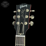 Gibson Les Paul headstock on a black background with 'Tone Shop' logo.