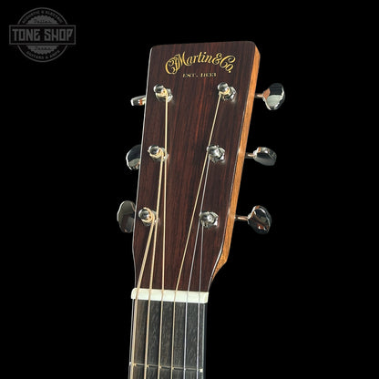 Guitar headstock with 'Martin & Co' branding on a black background