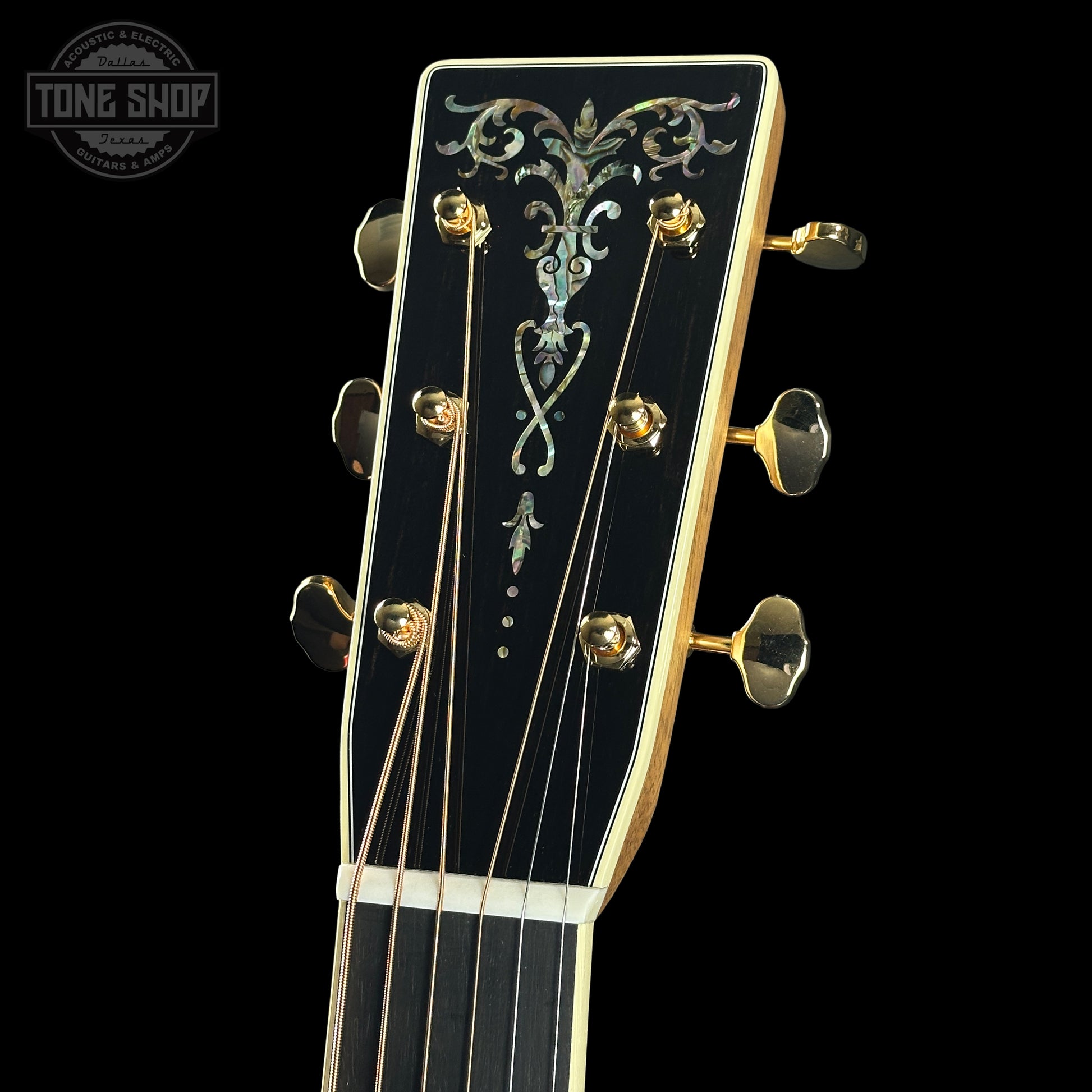 Headstock of Martin Custom Shop Dread 14-Fret Quilted Maple.