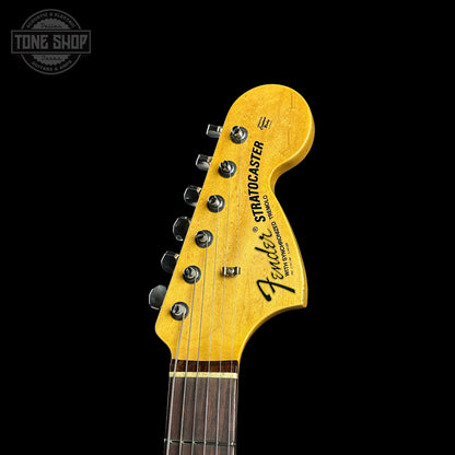 Fender Stratocaster guitar headstock on a black background