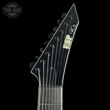 Close-up of a guitar neck with a brand logo on a black background