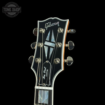Gibson Les Paul guitar headstock on a black background