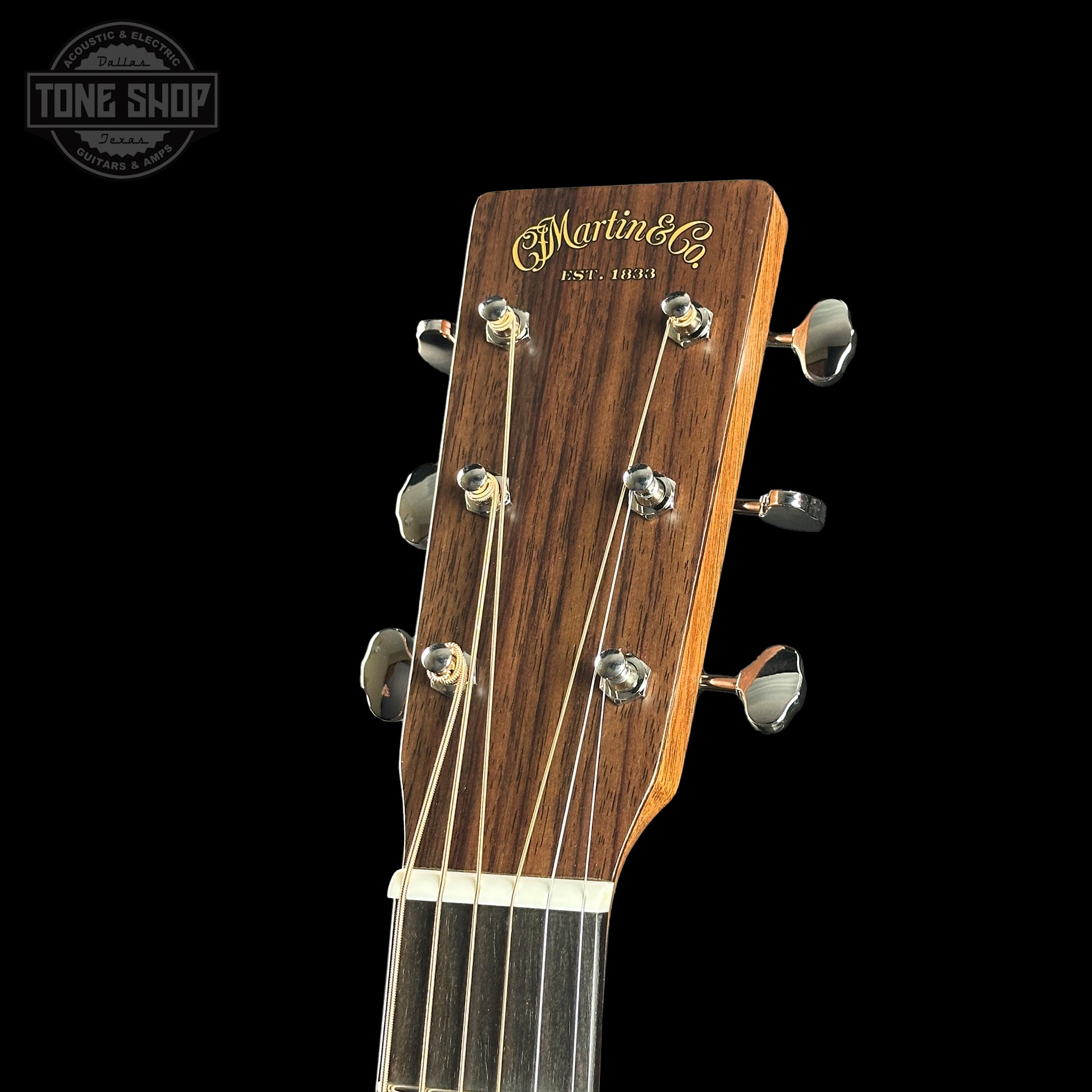 Headstock of Martin Custom Shop 000 14-Fret Jaguar Claw Mahogany.