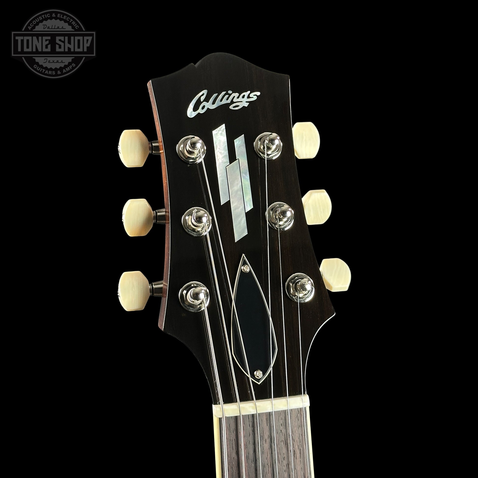 Collings guitar headstock with brand name on a black background