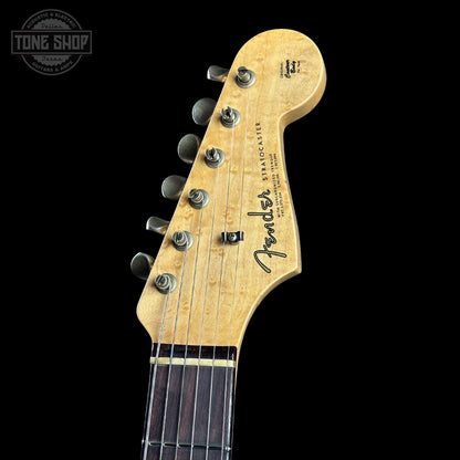 Fender Stratocaster guitar headstock on a black background with 'Tone Shop' logo.