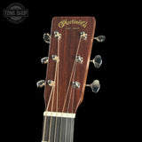 Guitar headstock with 'Martin & Co' branding on a black background