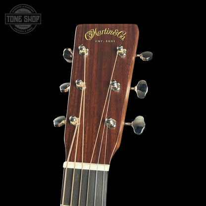 Guitar headstock with 'Martin & Co' branding on a black background