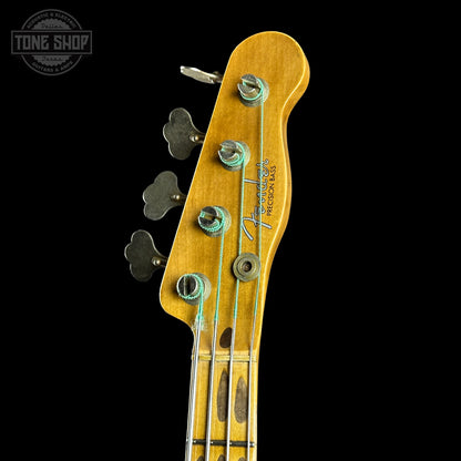 Fender Precision Bass headstock with 'Tone Shop' logo in the corner