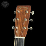 Guitar headstock with 'Martin & Co' branding on a black background