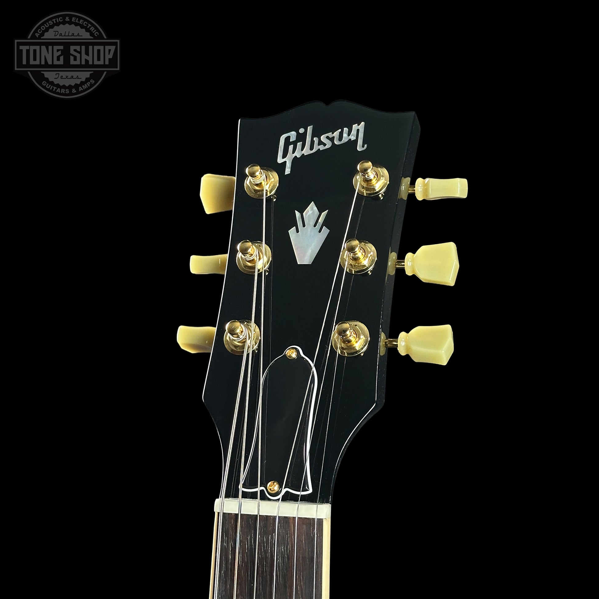 Gibson guitar headstock with black background