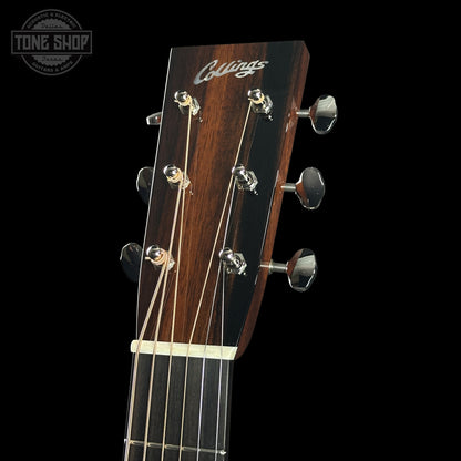 Guitar headstock with 'Collings' branding on a black background