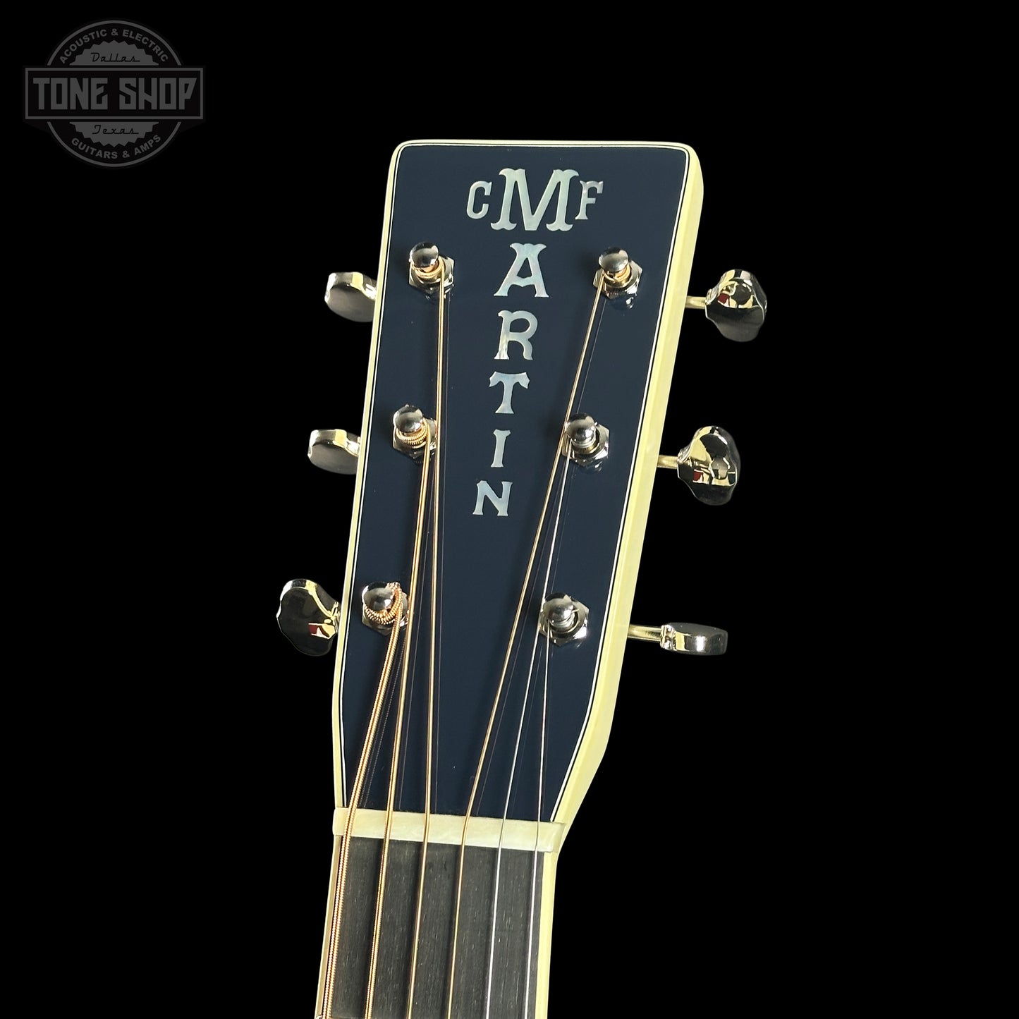Guitar headstock with 'Martin' branding on a black background