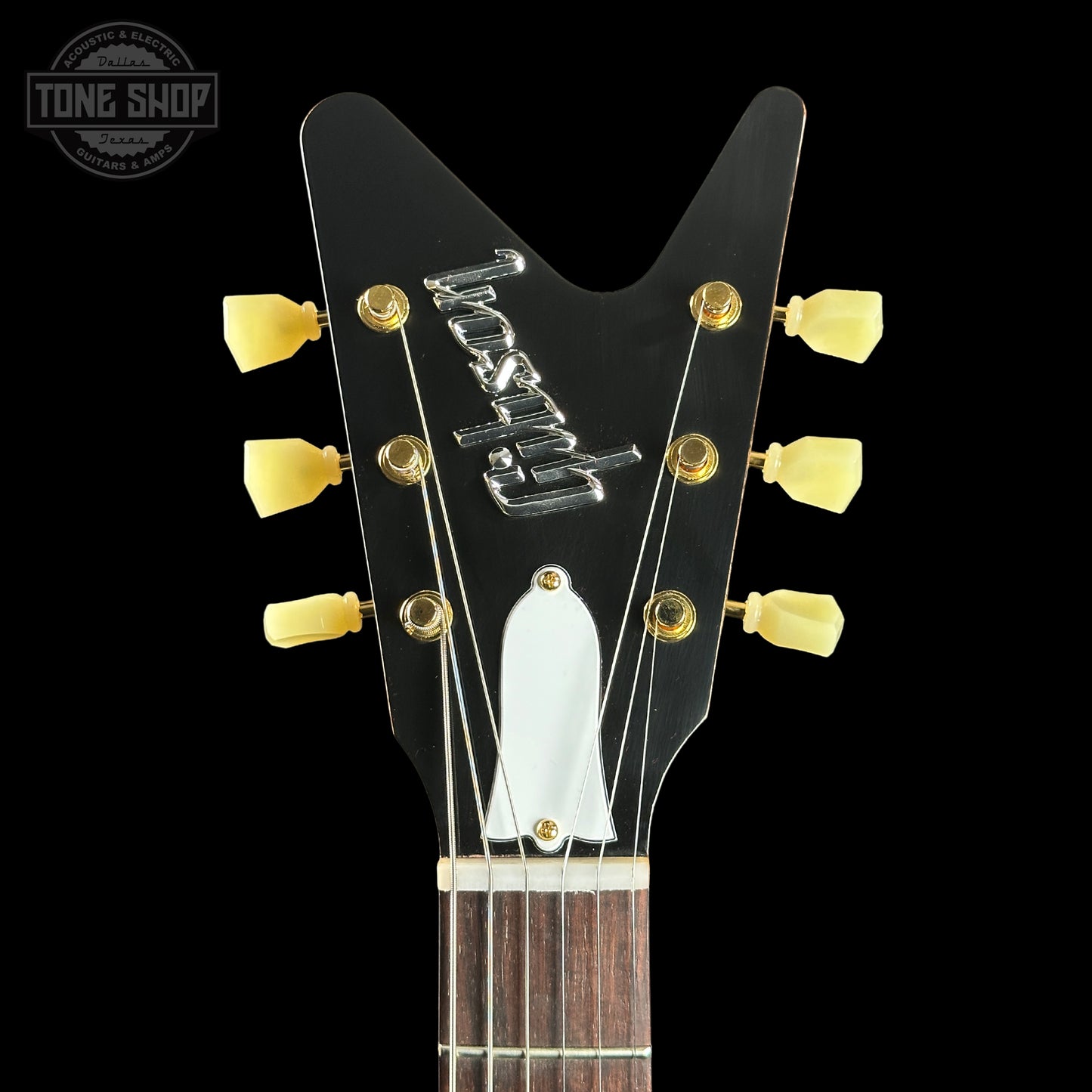 Guitar headstock with brand logo on a black background