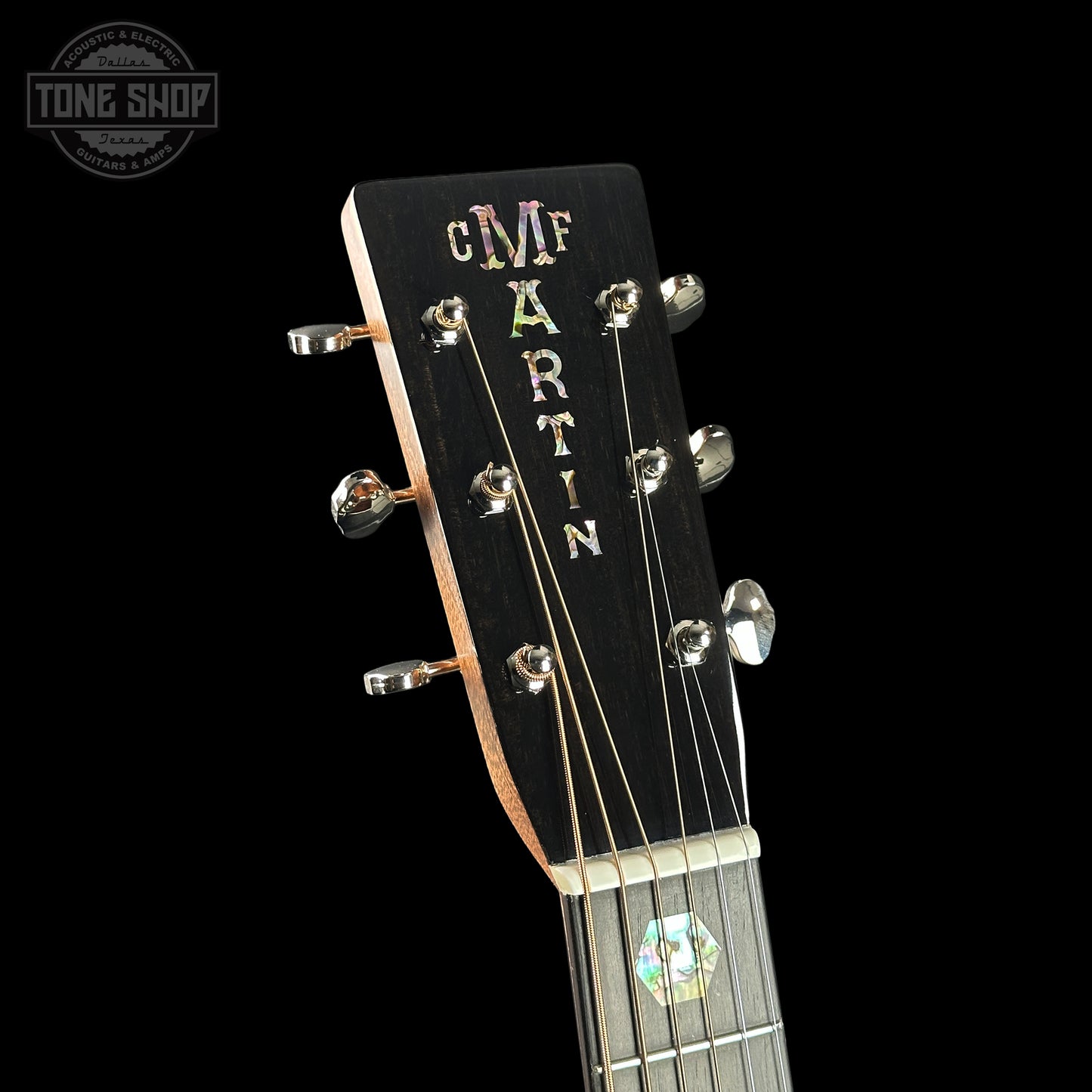 Guitar headstock with 'Martin' branding on a black background