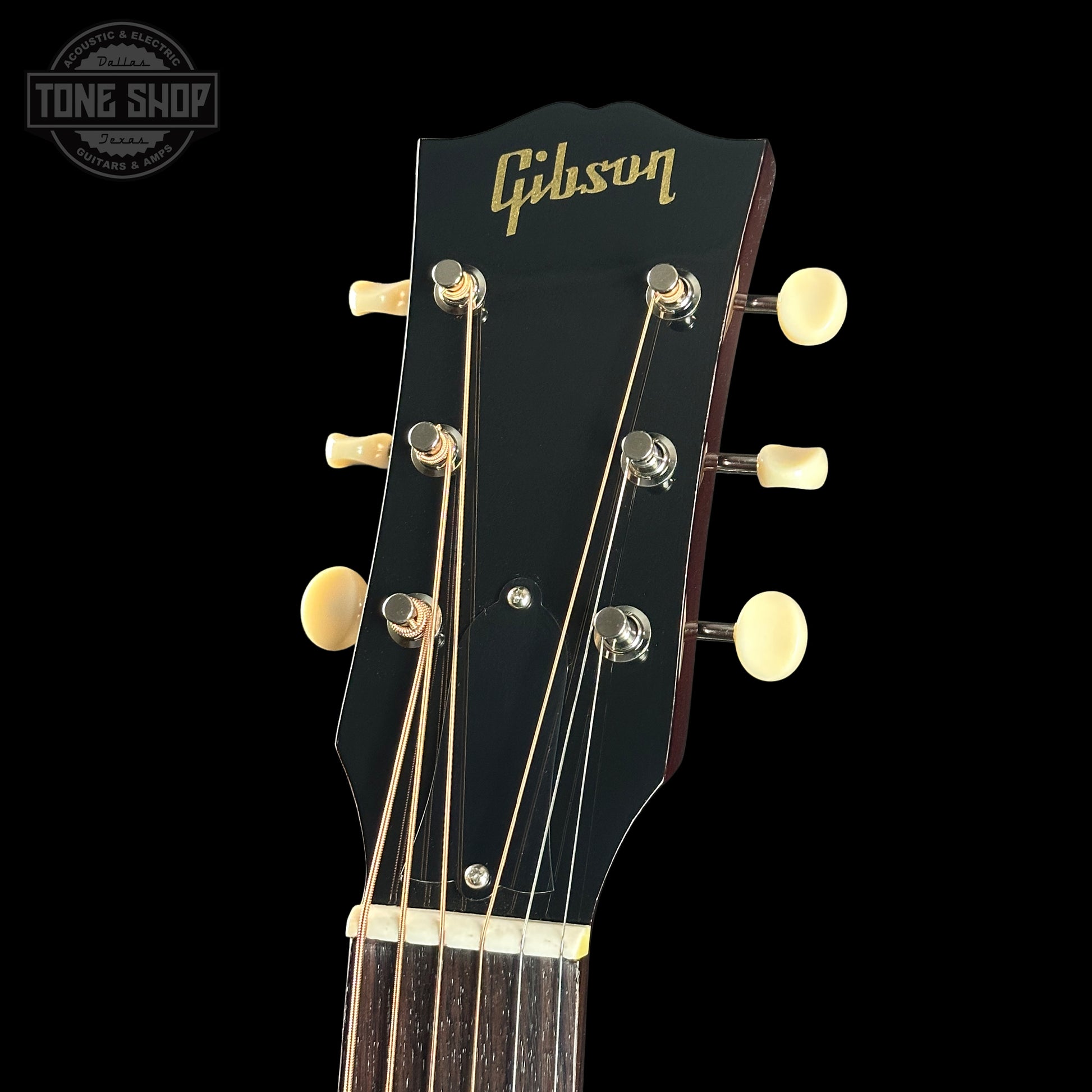 Gibson guitar headstock with black background