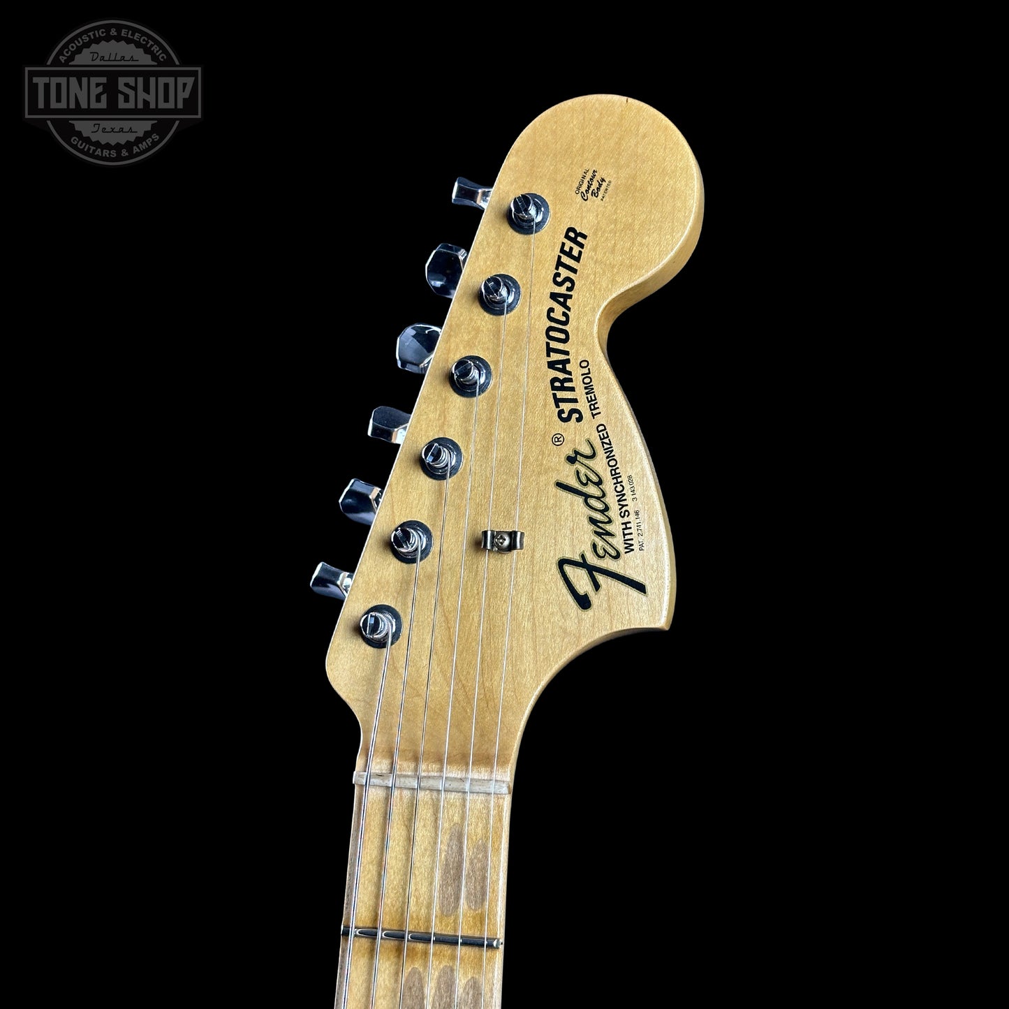 Fender Stratocaster headstock on a black background