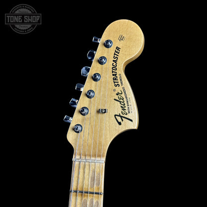 Fender Stratocaster headstock on a black background