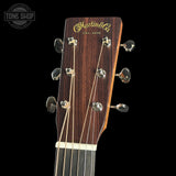 Guitar headstock with Martin & Co logo on a black background