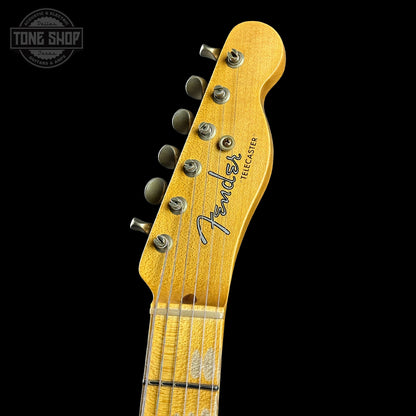 Fender guitar headstock on a black background with 'Tone Shop' logo.