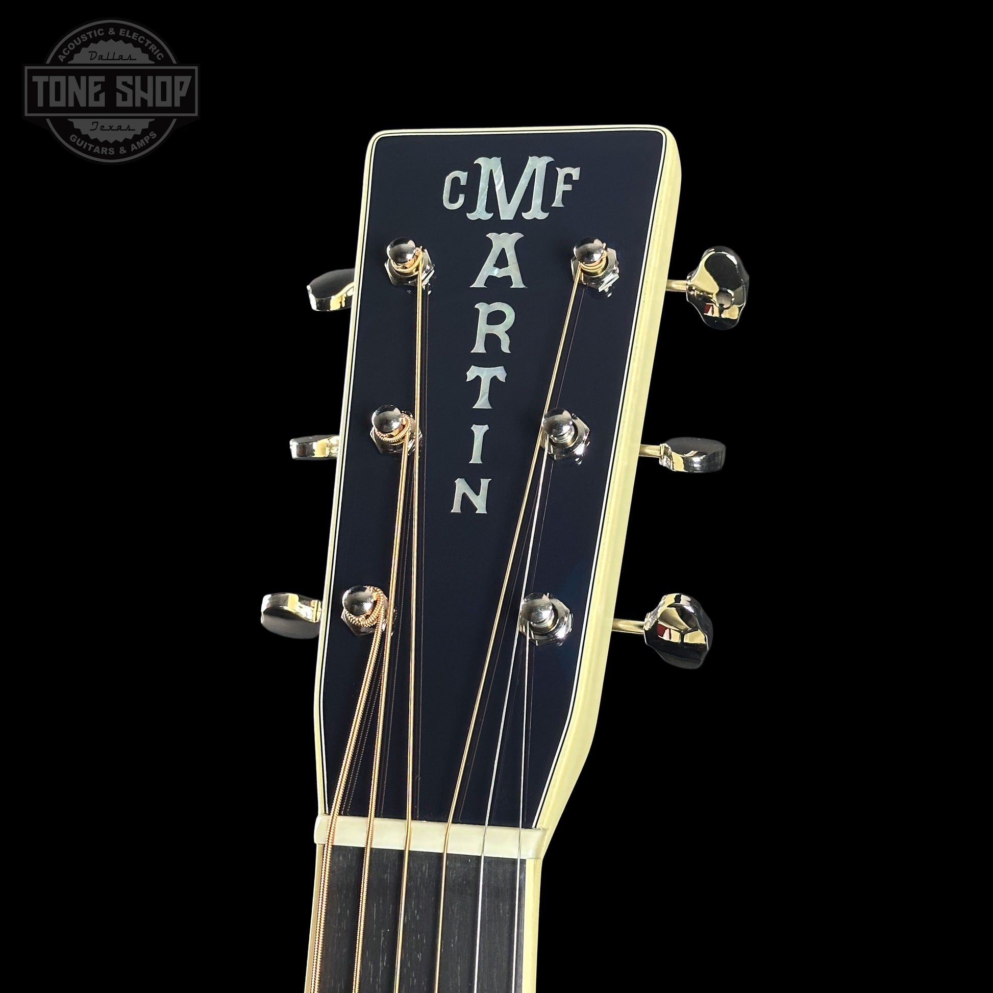 Guitar headstock with 'Martin' branding on a black background