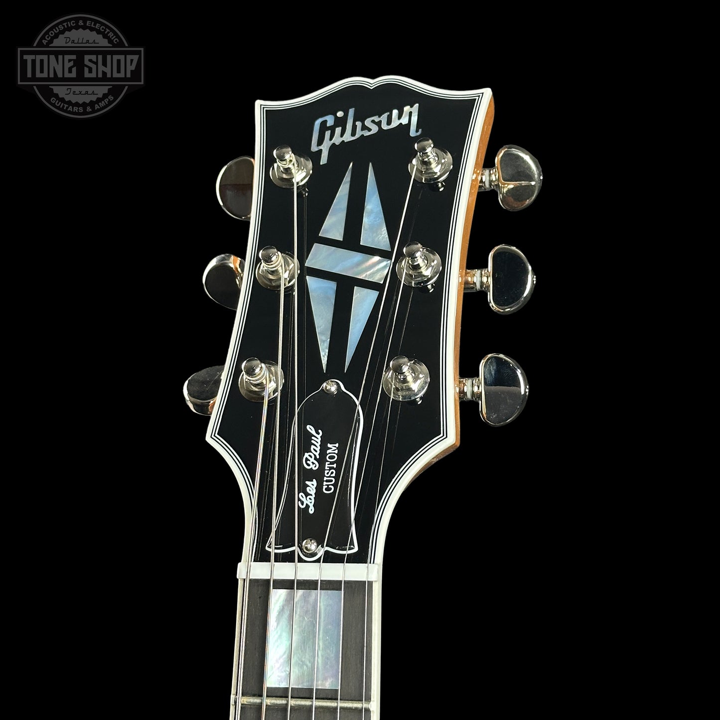 Headstock of Gibson Custom Shop TSG Anniversary Les Paul Custom Chambered 7A Quilt Trans Green.