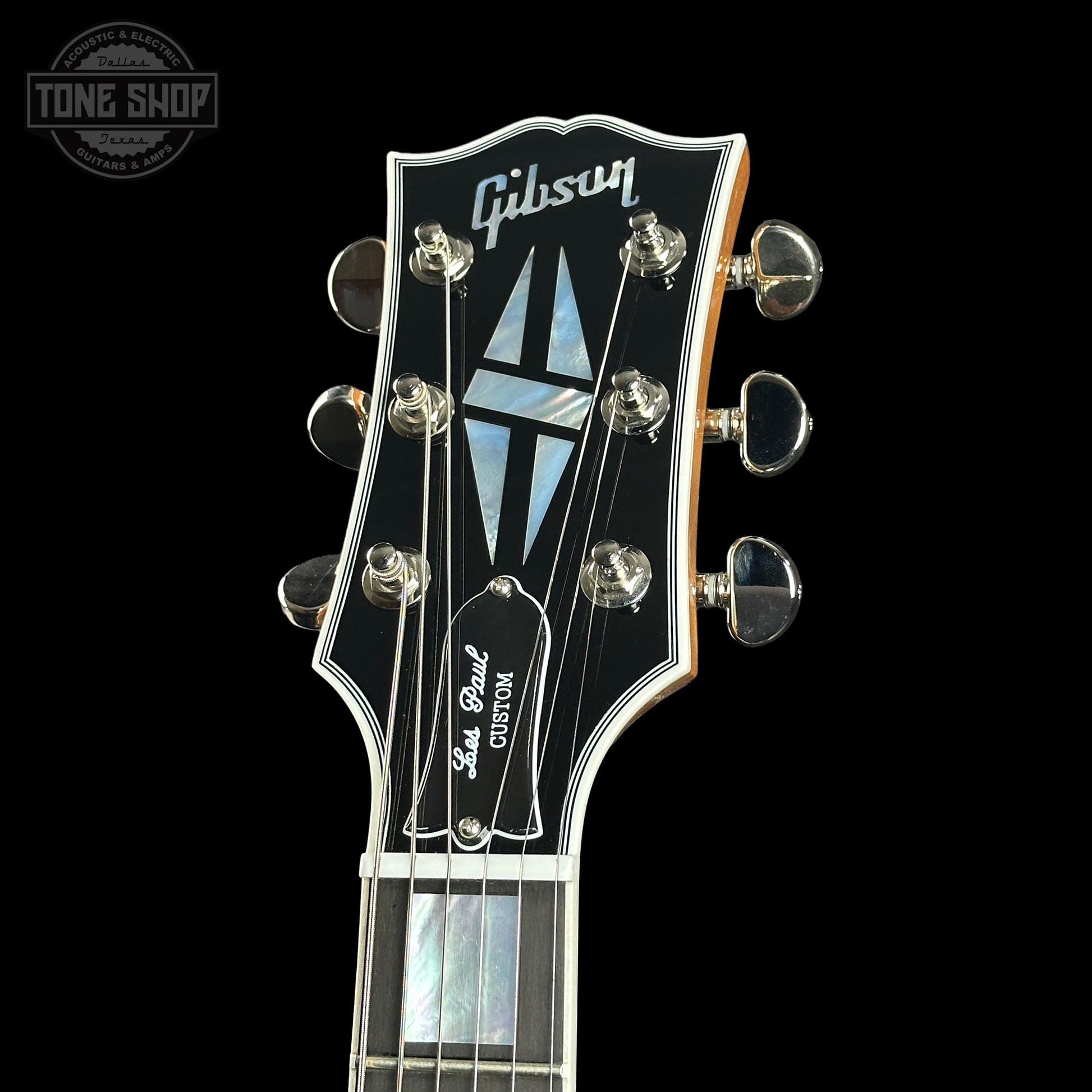Headstock of Gibson Custom Shop TSG Anniversary Les Paul Custom Chambered 7A Quilt Trans Green.